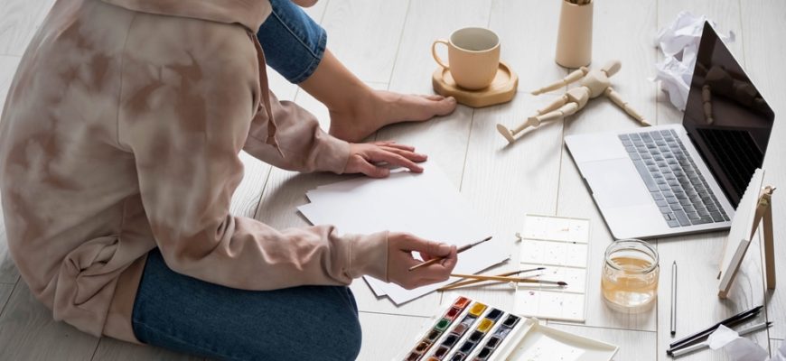 Woman,Painting,On,Canvas,,Sitting,On,Floor,At,Home.,Home